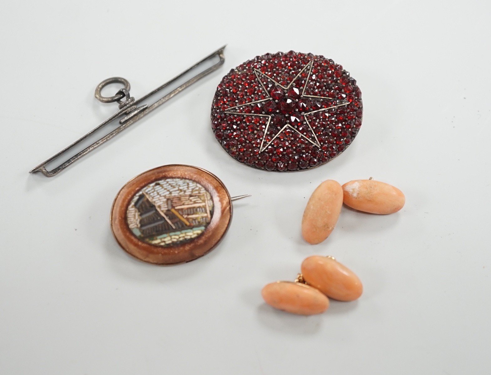 A pair of yellow metal and coral set cufflinks, coral 16mm and three assorted brooches including micro mosaic.